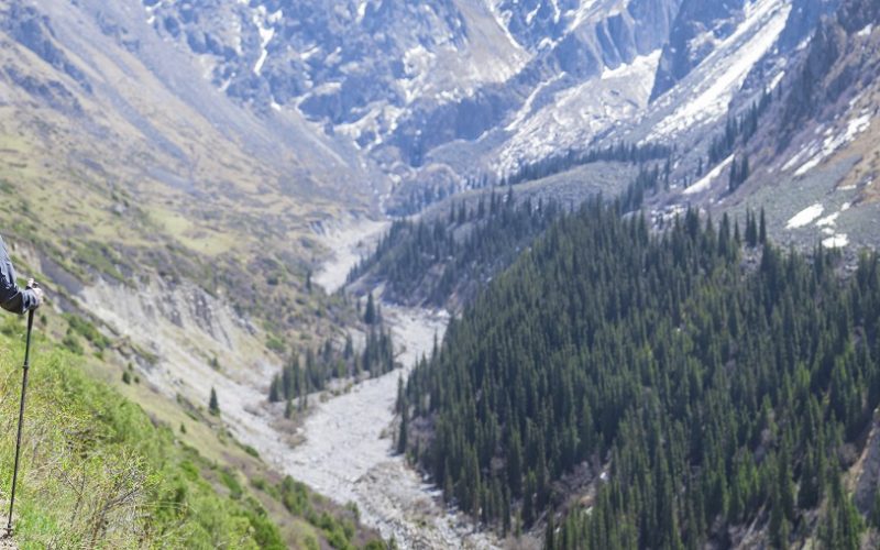 Trekker tourist in the beautiful Ala Archa gorge. Kyrgyzstan